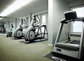 Thumbnail 33 of 66 - Fitness center with treadmill and exercise bikes.