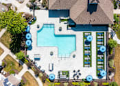 Thumbnail 5 of 17 - arial view of a pool and a house with a roof