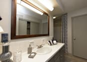 Thumbnail 10 of 18 - a bathroom with a sink and a mirror