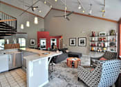 Thumbnail 1 of 12 - a large living room with a kitchen and a table at Village Club on Franklin, Southfield, MI