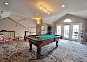 Thumbnail 2 of 12 - a game room with a pool table in the middle at Village Club on Franklin, Southfield Michigan