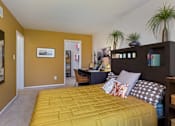 Thumbnail 40 of 47 - a bedroom with a yellow bed and a desk with a computer at Village Club of Rochester Hills, Shelby Township