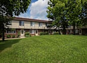 Thumbnail 5 of 47 - our apartments are located in a large grassy area with trees at Village Club of Rochester Hills, Shelby Township, MI