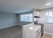 Thumbnail 8 of 10 - A kitchen area with a countertop and cabinets.