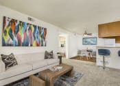 Thumbnail 7 of 17 - Living room with view of kitchen and barstools