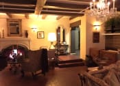 Thumbnail 22 of 35 - Lobby at night with the fire place on