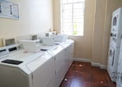 Thumbnail 4 of 25 - view of the dryers and window of laundry room
