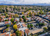 Thumbnail 33 of 37 - an aerial view of a neighborhood with houses and cars