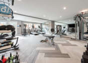 Thumbnail 13 of 37 - Wide shot of fitness center with cardio and strength equipment