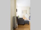 Thumbnail 14 of 35 - a living room with with a couch and furnace