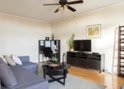Thumbnail 15 of 35 - living room with ceiling fan and home office in the corner