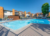 Thumbnail 4 of 37 - Wide angle view of the pool with buildings in the backdrop