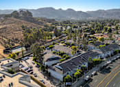 Thumbnail 52 of 67 - A residential area with houses and a road.