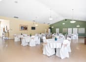 Thumbnail 44 of 67 - A banquet hall with tables set up for an event.