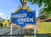 Thumbnail 11 of 67 - A blue sign the says doggy creek park