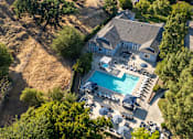Thumbnail 29 of 67 - A large house with a pool and a deck.