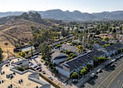 Thumbnail 50 of 67 - Arial view of the entire complex with mountains in the background