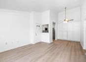 Thumbnail 67 of 67 - A room with a ceiling fan and wooden flooring.