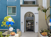 Thumbnail 27 of 49 - A blue and white building with a number 4940 on it.