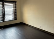 Thumbnail 31 of 35 - an empty room with a window and a ceiling fan