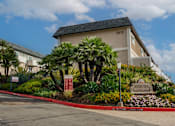 Thumbnail 1 of 35 - a building with a garden in front of it