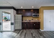 Thumbnail 7 of 35 - a kitchen with dark wood cabinets and stainless steel appliances