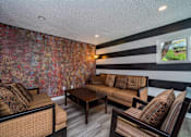 Thumbnail 5 of 35 - a living room with couches and a coffee table