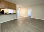Thumbnail 6 of 11 - Living room with hardwood floors