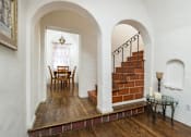 Thumbnail 18 of 27 - Villa Valentino 14 Dining Room and a brown staircase with arched ceilings