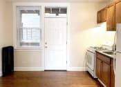 Thumbnail 34 of 38 - a kitchen with a stove and a refrigerator