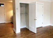 Thumbnail 35 of 38 - a bedroom with a closet and a door open