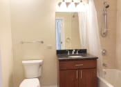 Thumbnail 16 of 23 - a bathroom with a toilet sink and bathtub