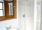 Thumbnail 38 of 48 - a small bathroom with a white sink and shower