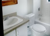Thumbnail 30 of 48 - a small bathroom with a toilet sink and bathtub
