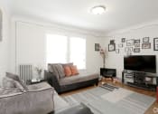 Thumbnail 14 of 38 - a living room with two couches and a tv