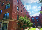Thumbnail 3 of 38 - a red brick building on a sunny day