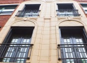 Thumbnail 41 of 48 - the facade of a building with windows and a balcony