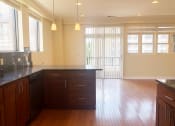 Thumbnail 10 of 23 - a view of the kitchen and living room from the dining room
