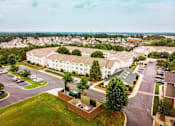 Thumbnail 92 of 109 - A large white building with a green lawn in front.