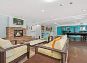 Thumbnail 73 of 74 - a living room with couches a fireplace and a pool table