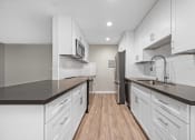 Thumbnail 1 of 67 - Modern Kitchen Design at Los Robles Apartments in Pasadena, CA