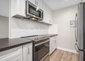 Thumbnail 2 of 67 - Kitchen With New Appliances at Los Robles Apartments, Pasadena, CA