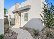 Thumbnail 24 of 36 - A modern house with a stone pillar entrance.