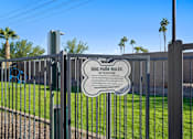 Thumbnail 31 of 36 - A sign on a fence that says Dog Park Rules Attention.