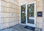 Thumbnail 18 of 40 - A white door with a glass window and a sign on it.