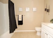 Thumbnail 59 of 80 - Bathroom with bathtub, white toilet and  sink