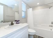 Thumbnail 56 of 60 - a bathroom with a sink toilet and a shower