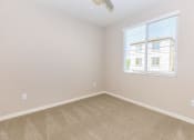 Thumbnail 24 of 72 - an empty bedroom with a window and carpet
