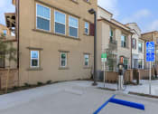 Thumbnail 6 of 60 - an empty parking lot in front of an apartment building