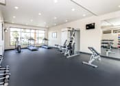 Thumbnail 41 of 60 - the gym has plenty of weights and cardio equipment and a large window
